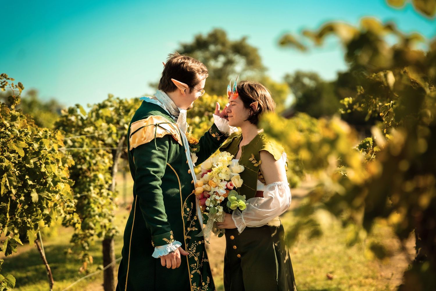 A romantic couple shares a special moment among sunlit vineyard rows on a beautiful day. Fantasy, D&D styled wedding and ceremony.