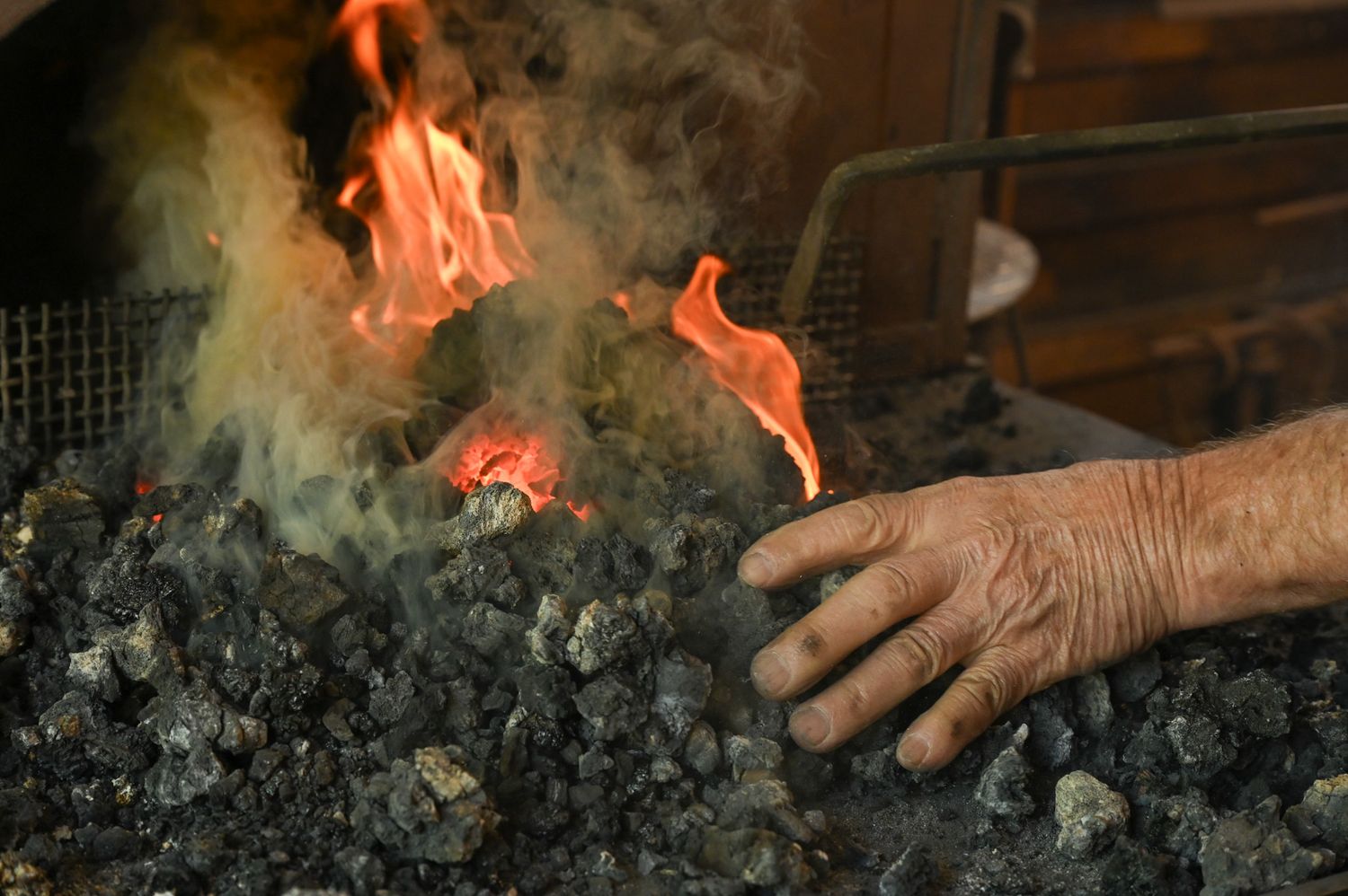 George B. Robb II tends to his fire