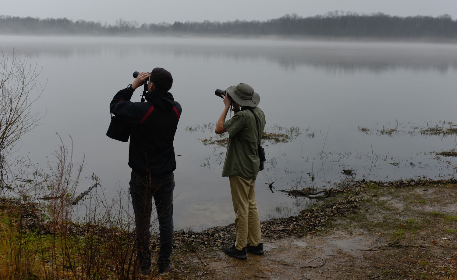 Daden Hartz, left, and Levi Hartz, 16, use their respective tools to search for birds