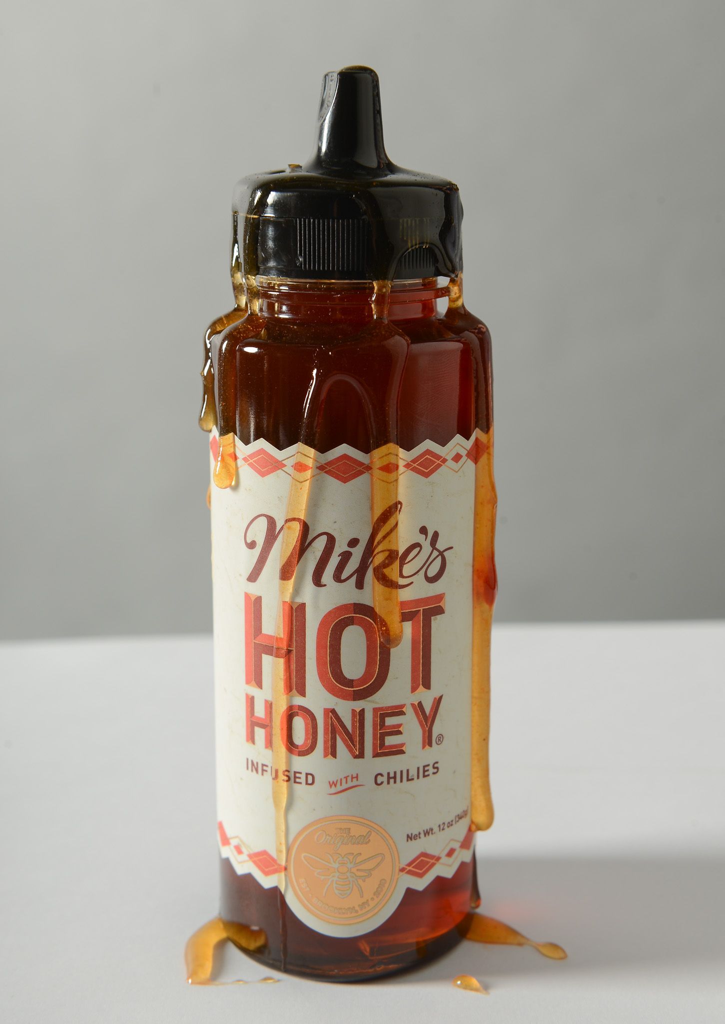 Mike's Hot Honey bottle covered in hot honey