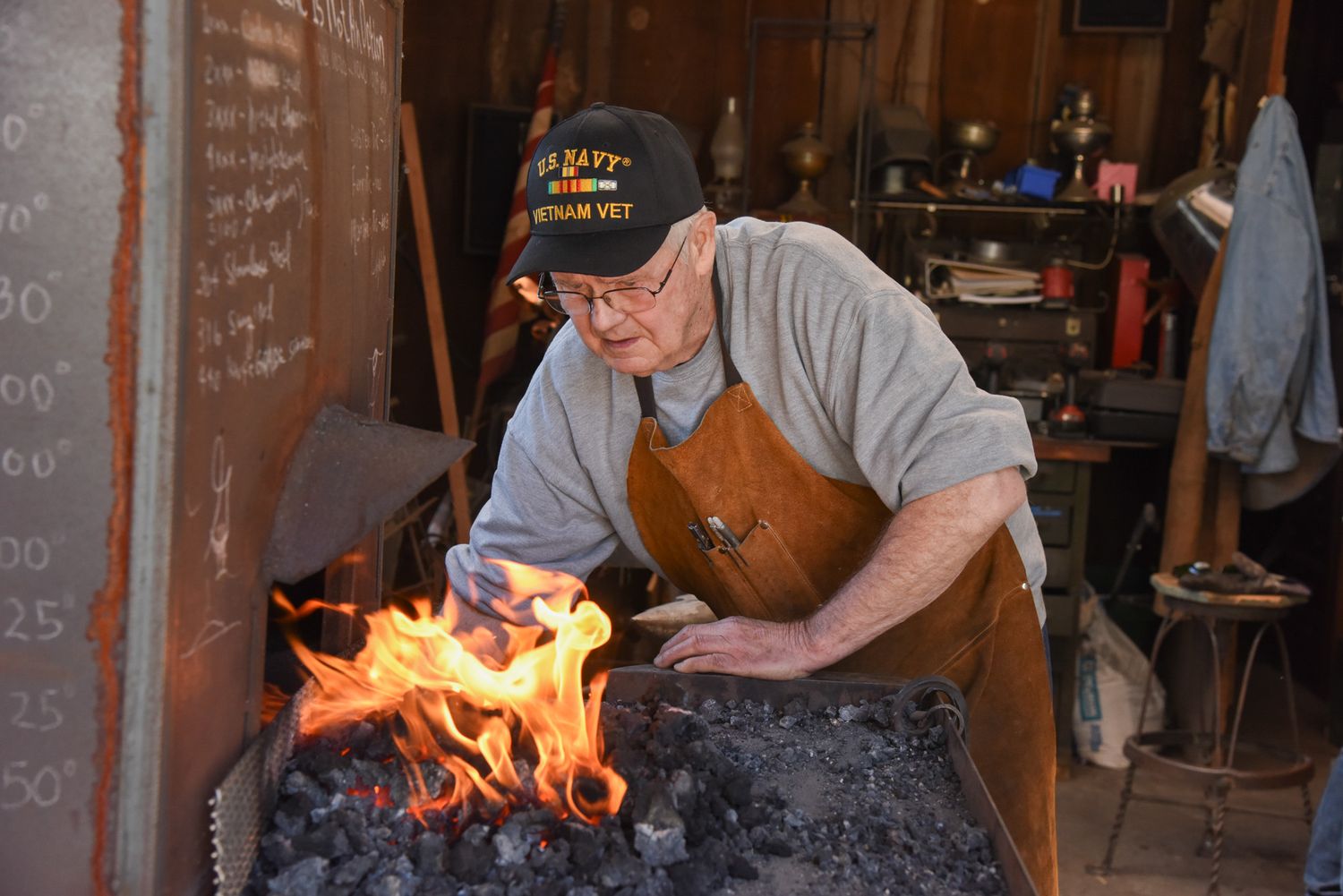 George B. Robb II tends to his forge