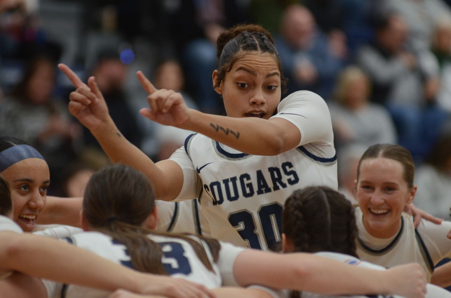 Columbia College forward Jasmine Taylor dances with her team before the Cougars' game against William Woods
