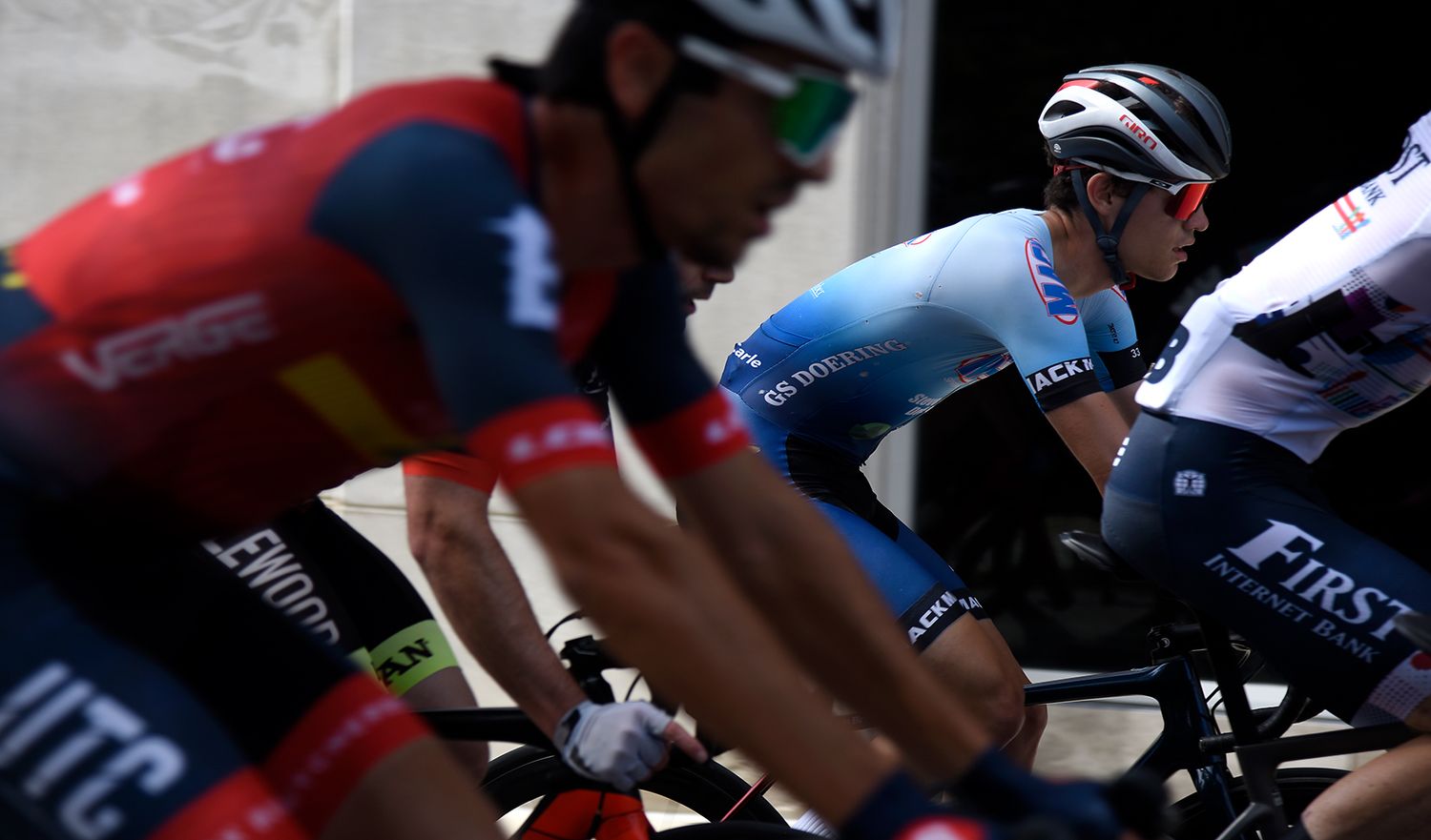 Justin Bird, right, cycles down the road surrounded by competitors during Criterium at the Columns
