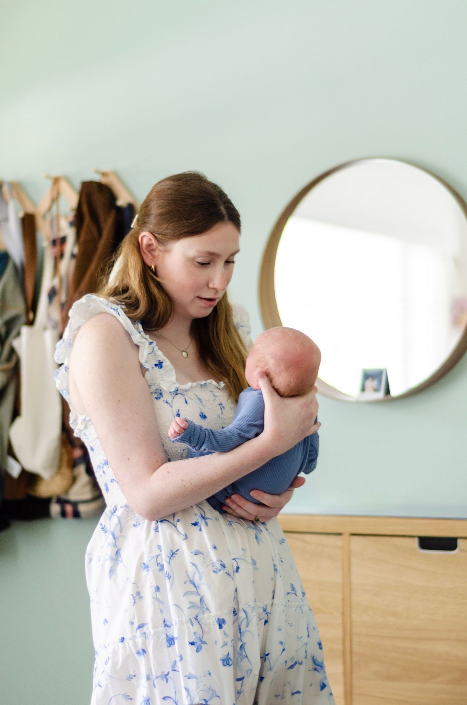 Indoor portrait series showing tender moments with a baby. Newborn photos by KM Conceptions Photography in Columbus, OH.