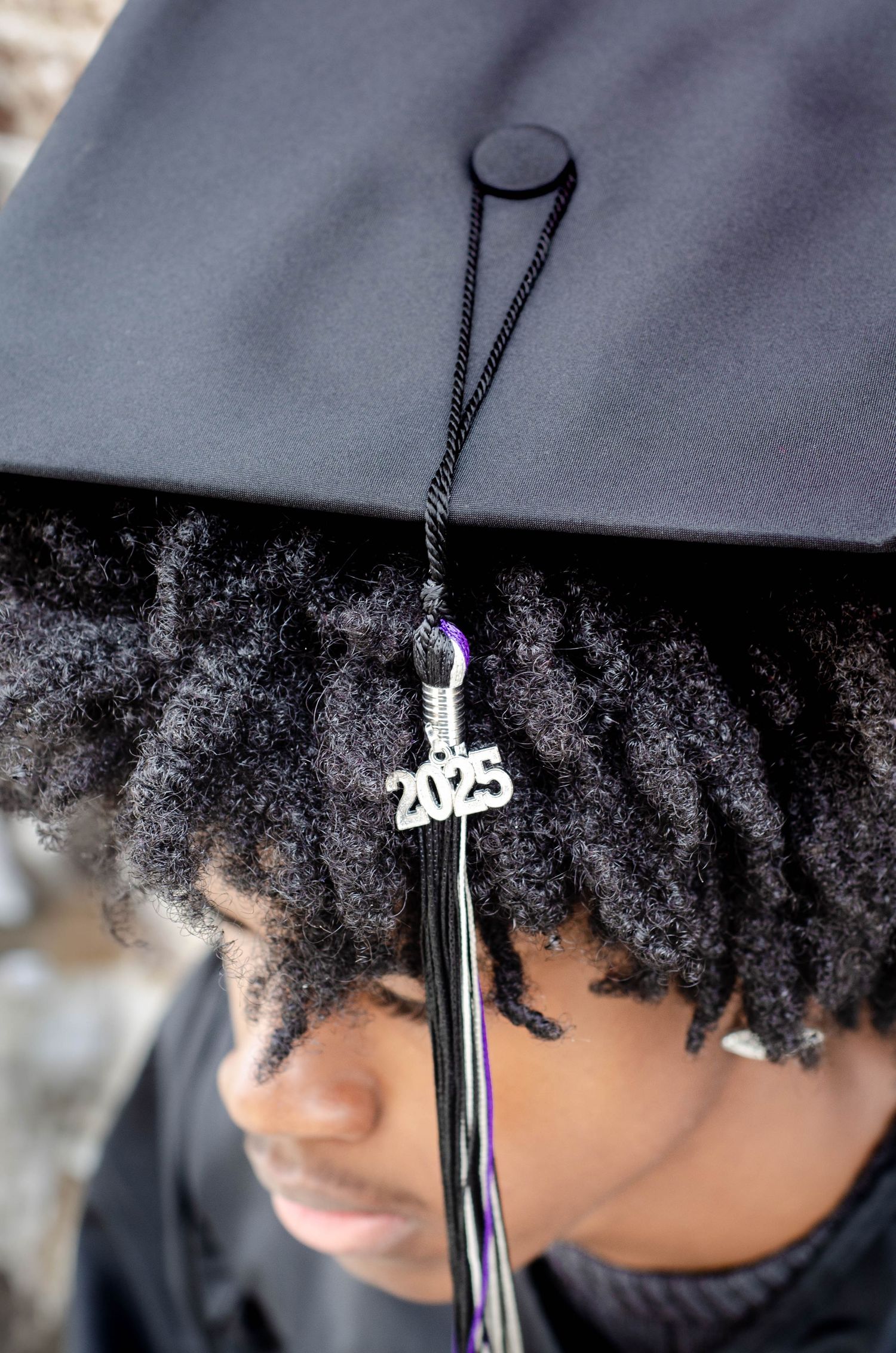 Close-up of graduation cap with 2023 tassel decoration.