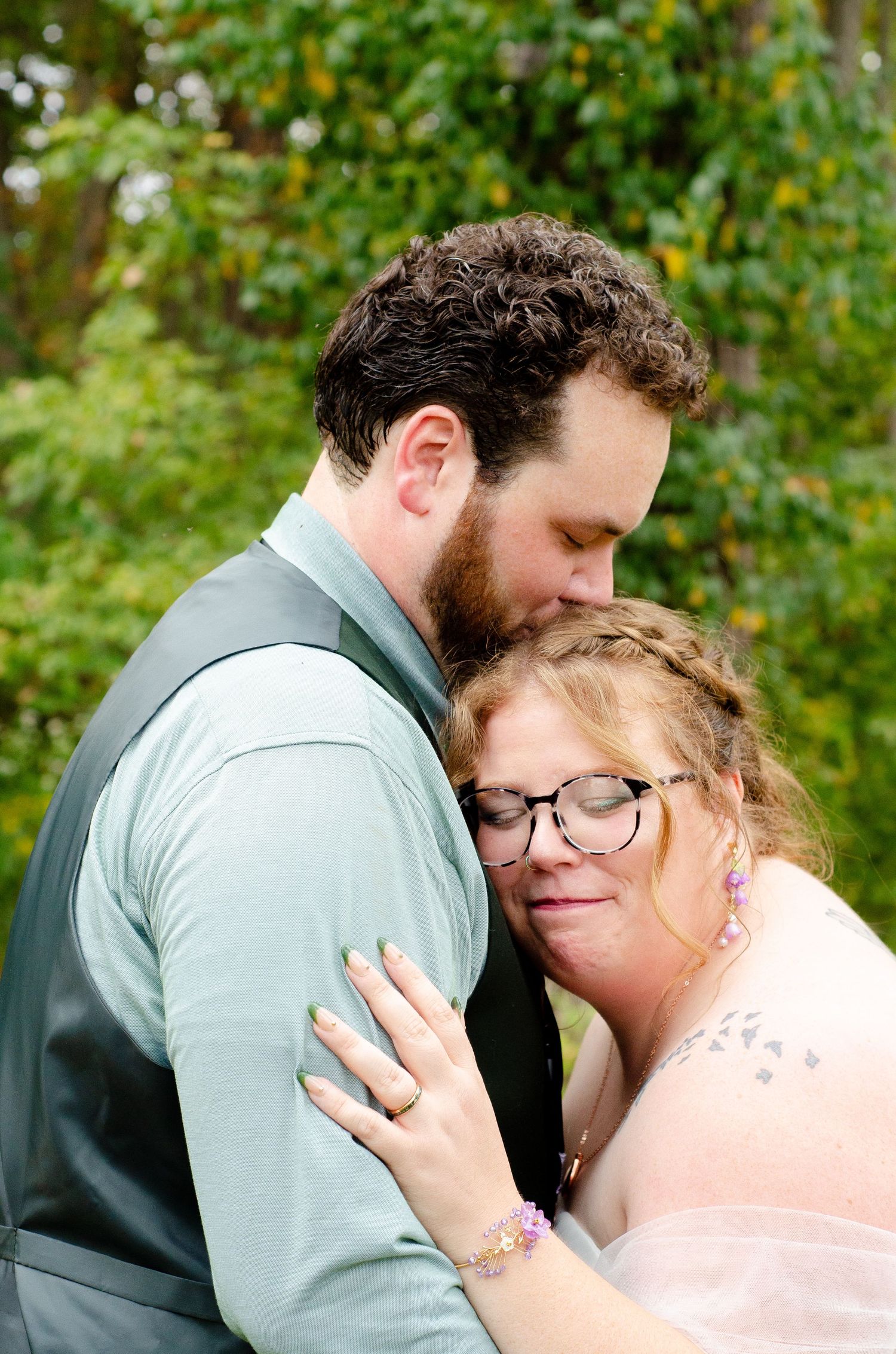 Intimate moment captured in an outdoor garden setting. Photos taken by KM Conceptions Photography in Newark, OH.