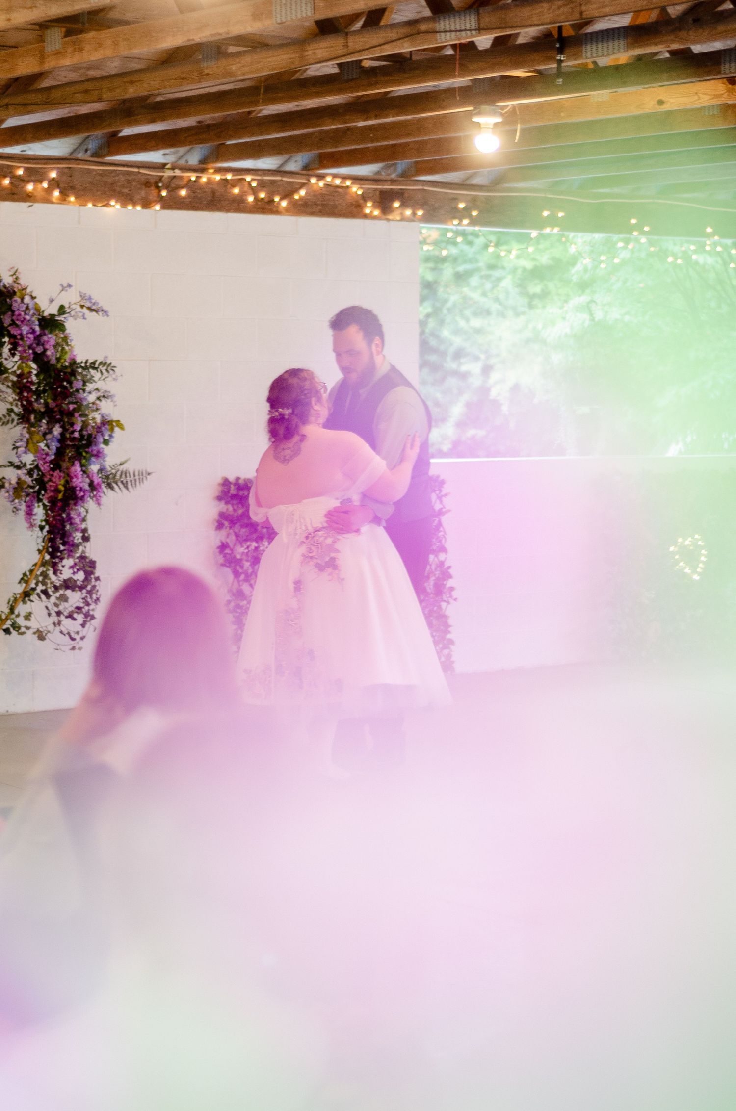 Dreamy dance scene with fog effects and twinkling lights in an indoor venue. Photos taken by KM Conceptions Photography in Newark, OH.