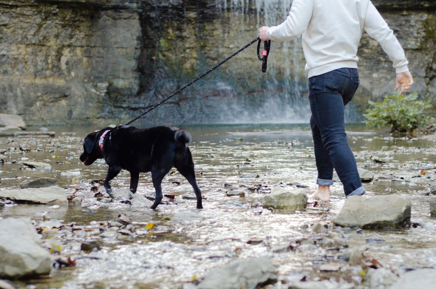 Walking along a rocky creek bed near a waterfall. Photos by KM Conceptions Photography in Columbus, OH.