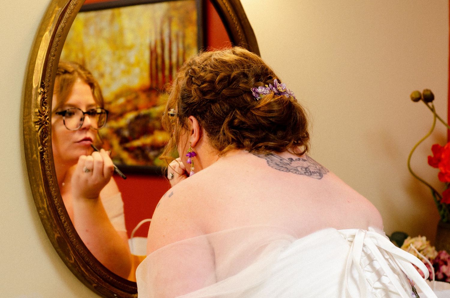 Intimate indoor wedding preparation moments captured in warm lighting. Wedding photos by KM Conceptions Photography in Columbus, OH.