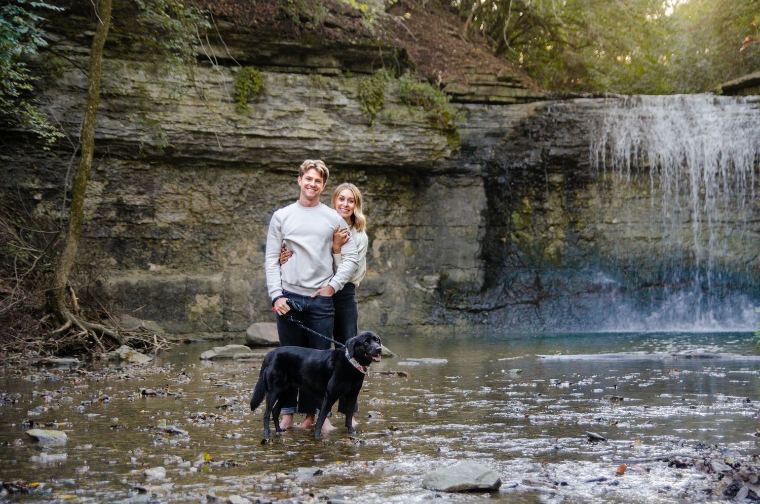 Waterfall flowing over limestone cliffs in a wooded setting. Photos by KM Conceptions Photography.