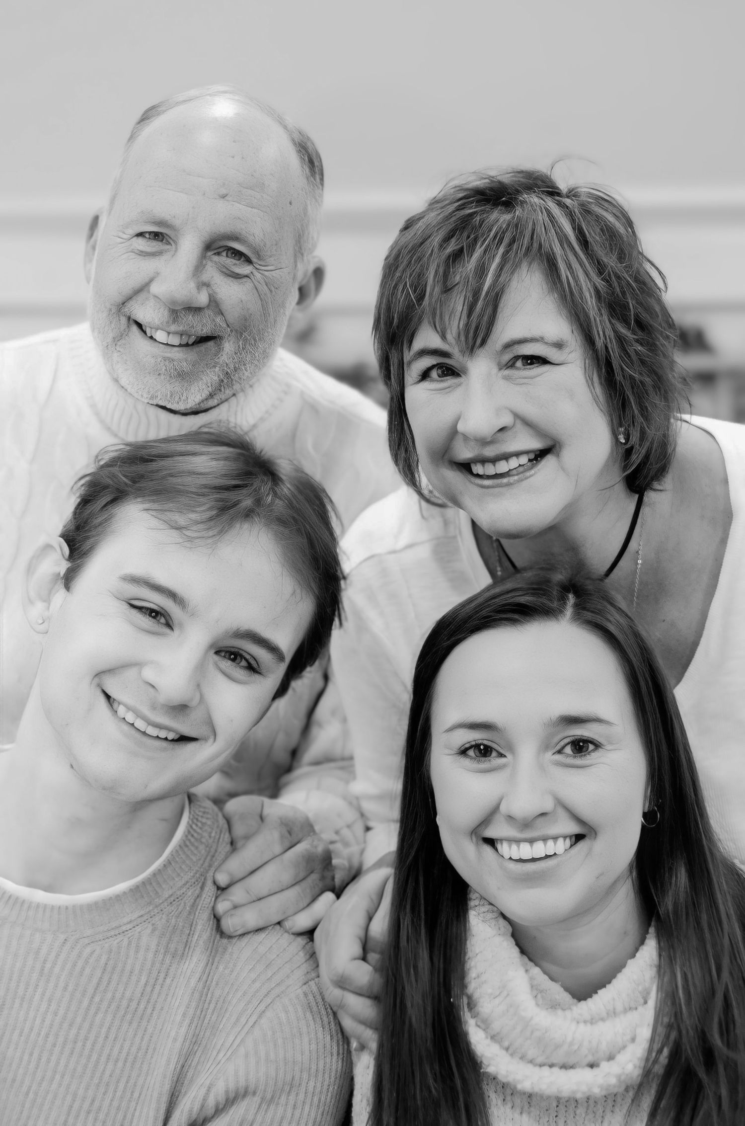 Black and white portrait of group sharing intimate moments together.