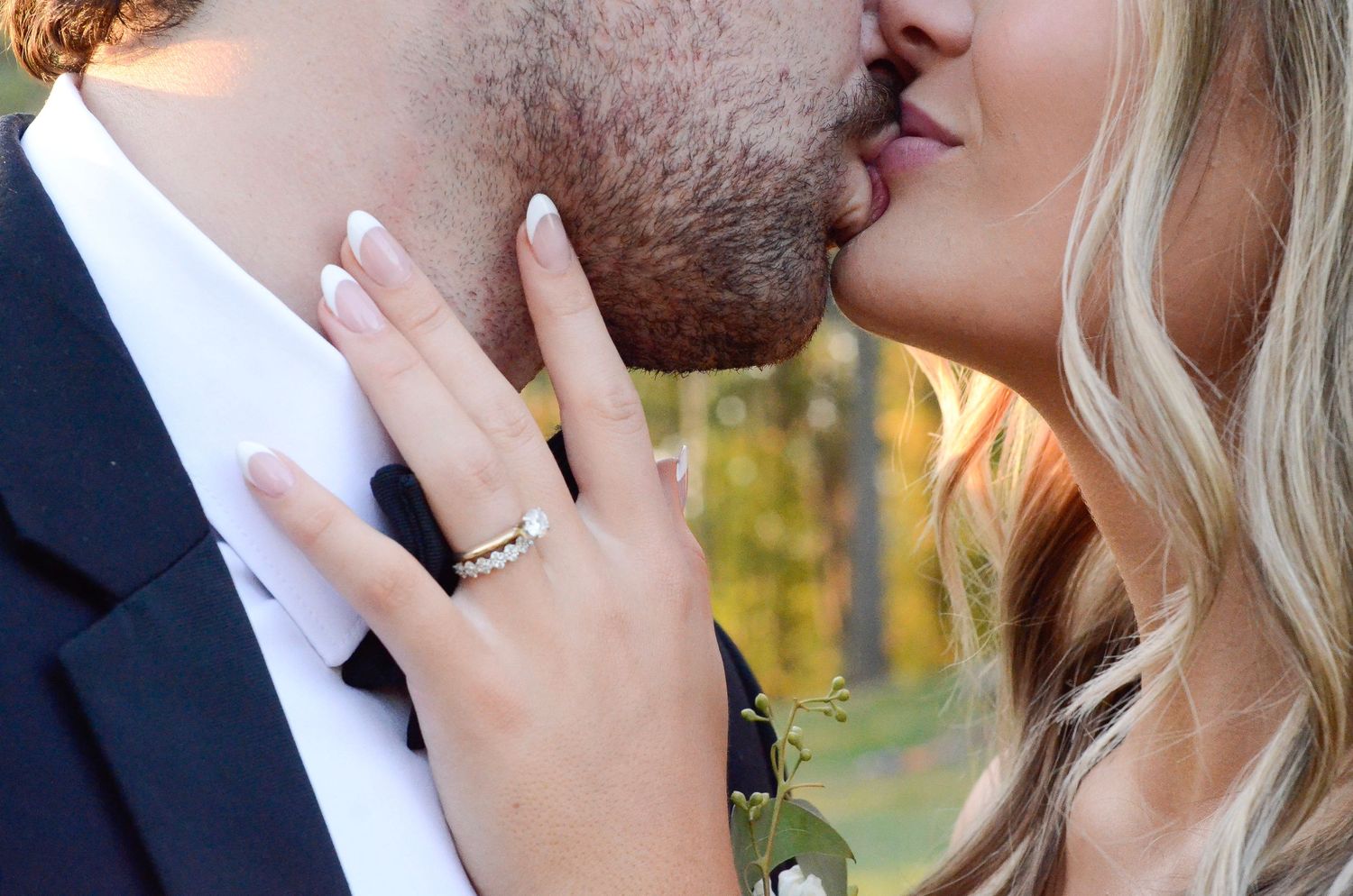 Romantic close-up wedding portrait showing a tender kiss between newlyweds. Wedding photos by KM Conceptions Photography in Columbus, OH.
