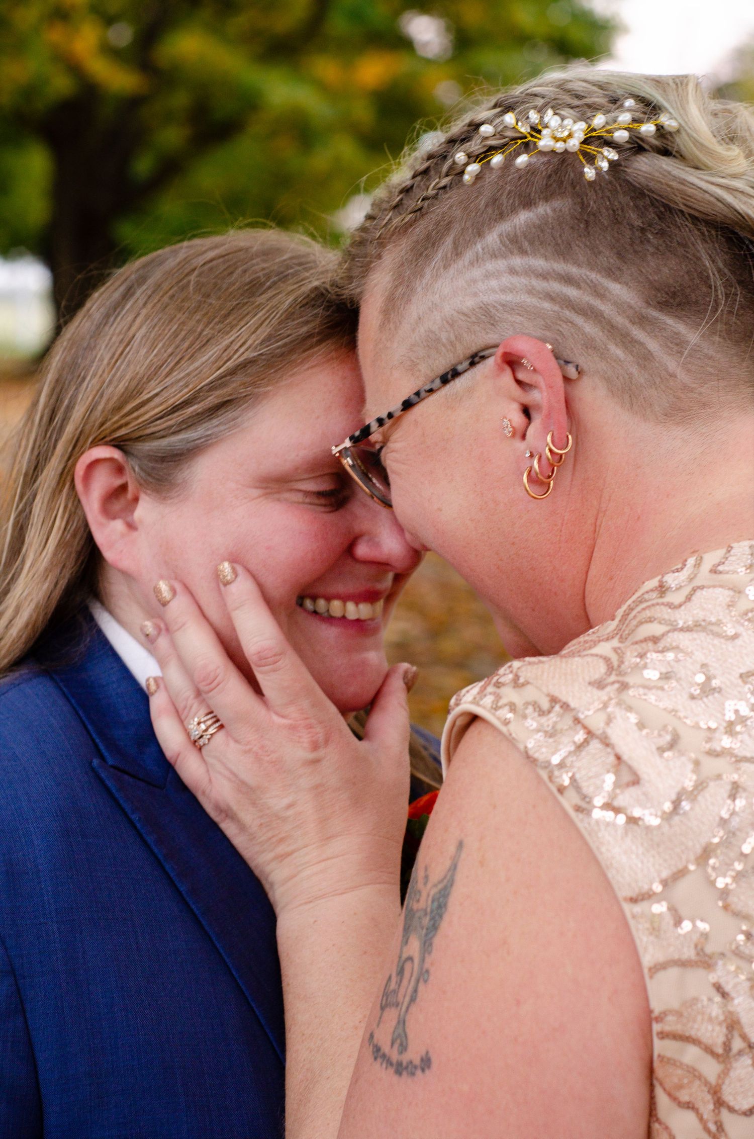 A tender romantic moment shared between newlyweds during their autumn outdoor wedding. Photos by KM Conceptions Photography.