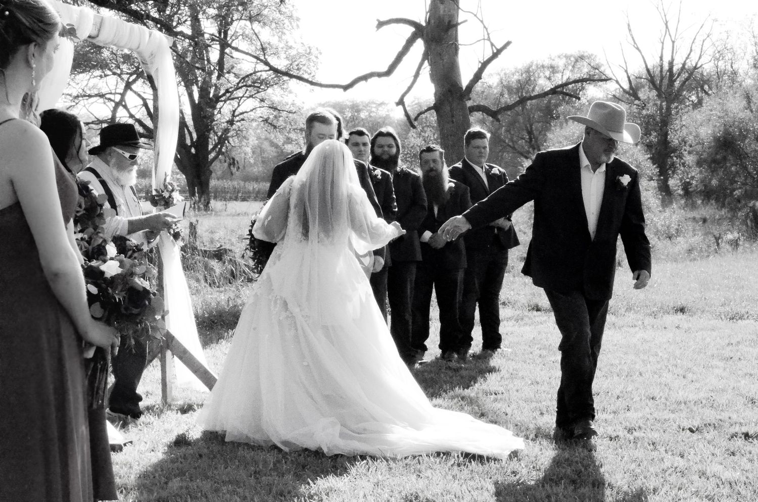 Black and white wedding party celebration outdoors with guests in formal attire.Wedding photos by KM Conceptions Photography in Columbus, OH