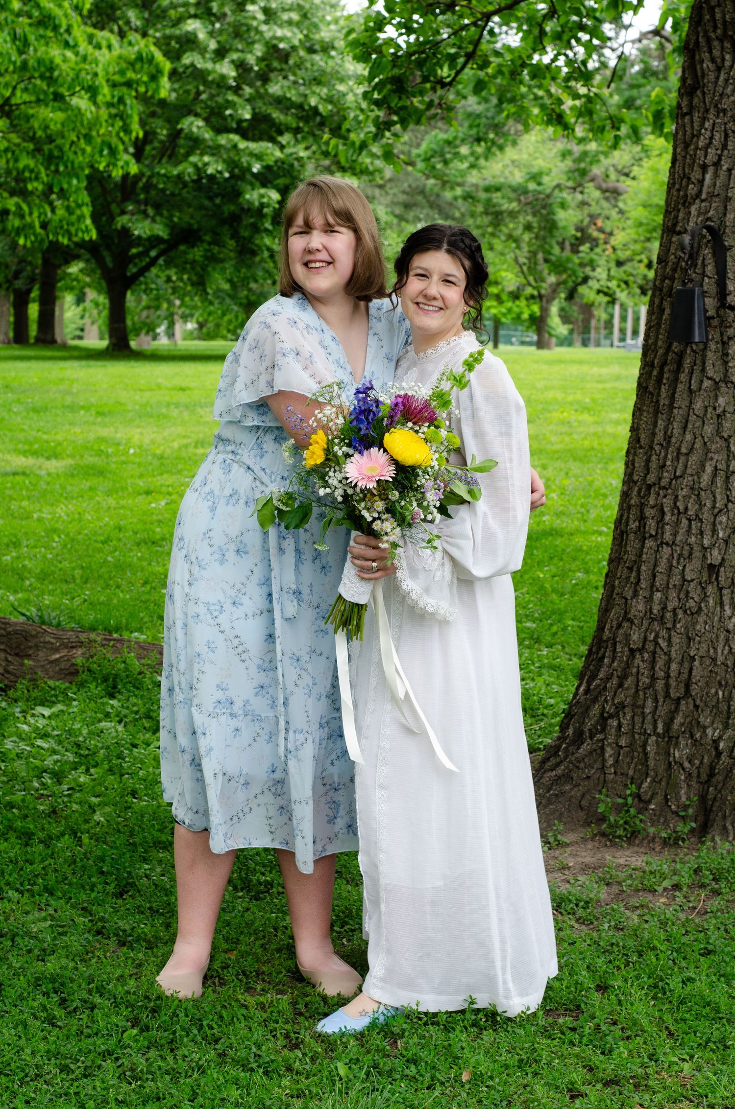 Sisters taking pictures to celebrate. Wedding photos by KM Conceptions Photography in Columbus, OH.
