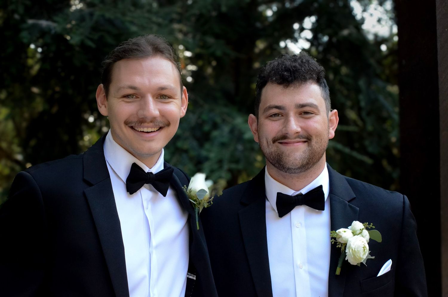 Formal group wearing black tuxedos and bow ties at outdoor event. Wedding photos by KM Conceptions Photography in Columbus, OH.