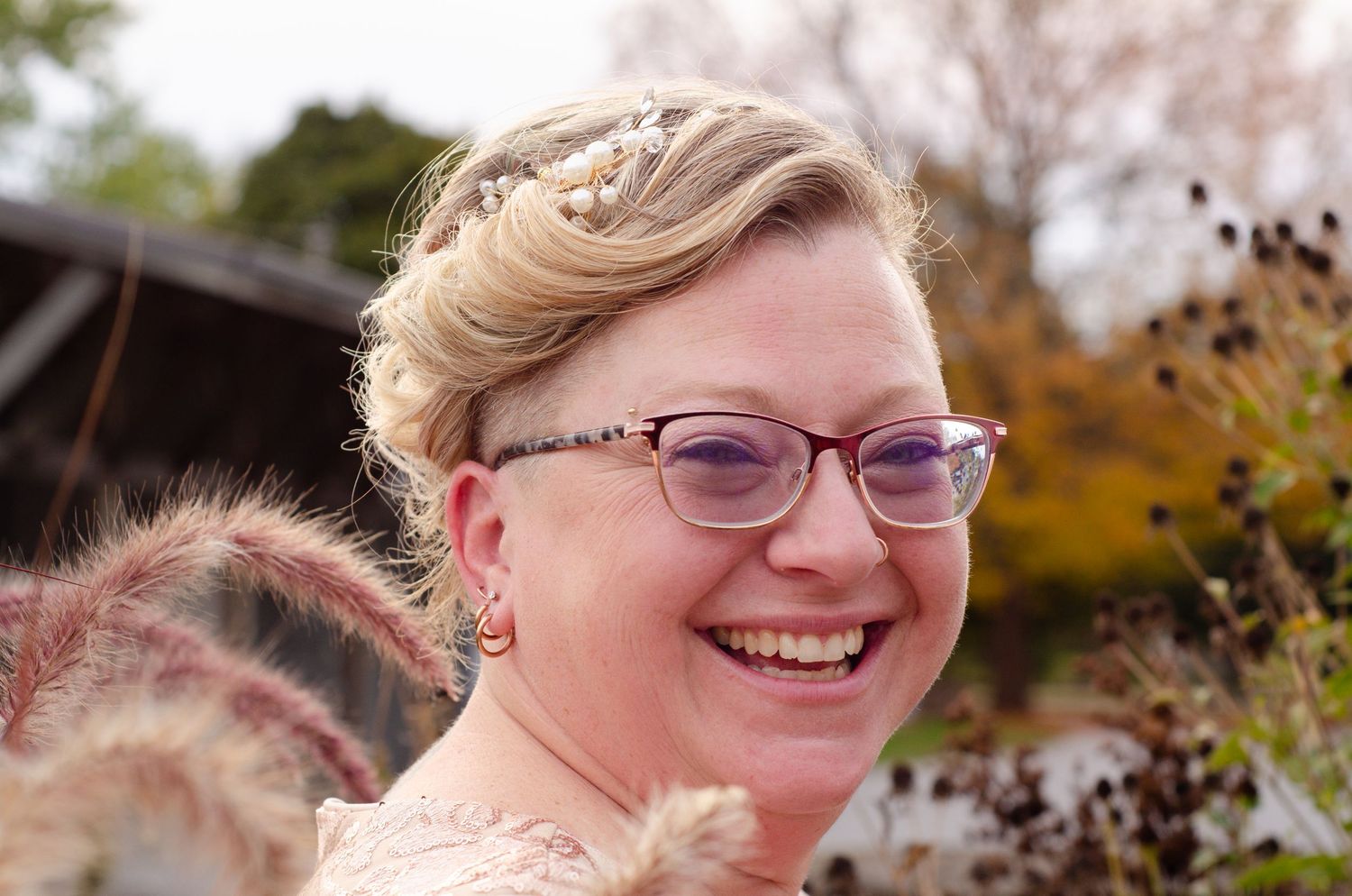 A joyful moment captured during an autumn wedding celebration outdoors. Photos by KM Conceptions Photography.
