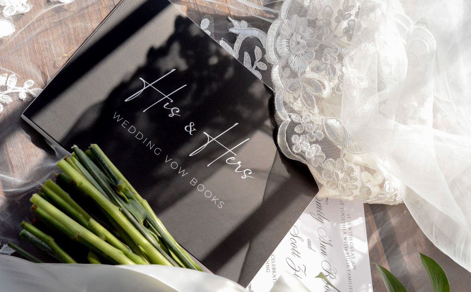 White wedding bouquet with fresh green stems wrapped in black ribbon. Wedding photos by KM Conceptions Photography in Columbus, OH.