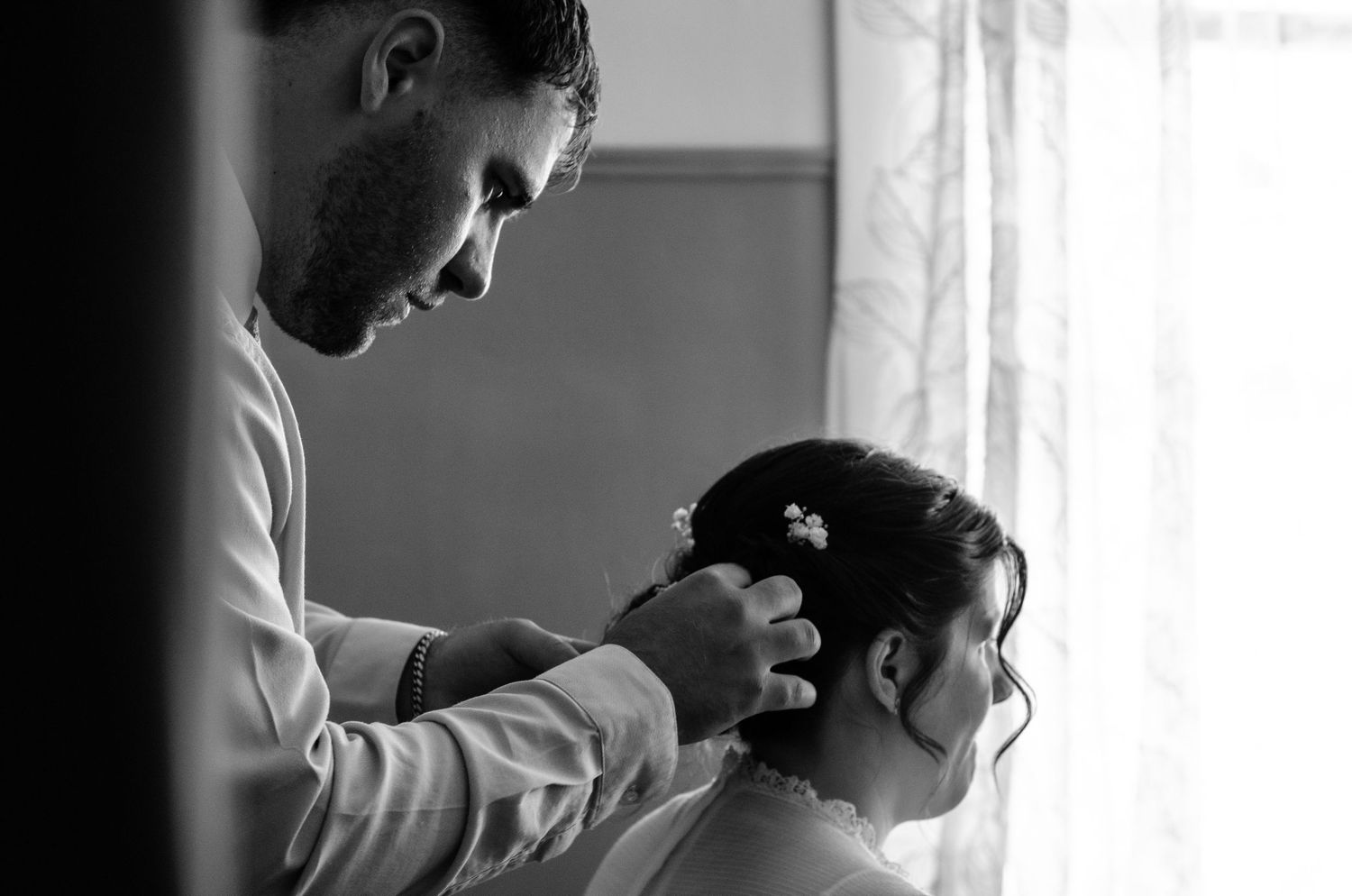 Black and white intimate wedding moments captured in window light. Wedding photos by KM Conceptions Photography in Columbus, OH.