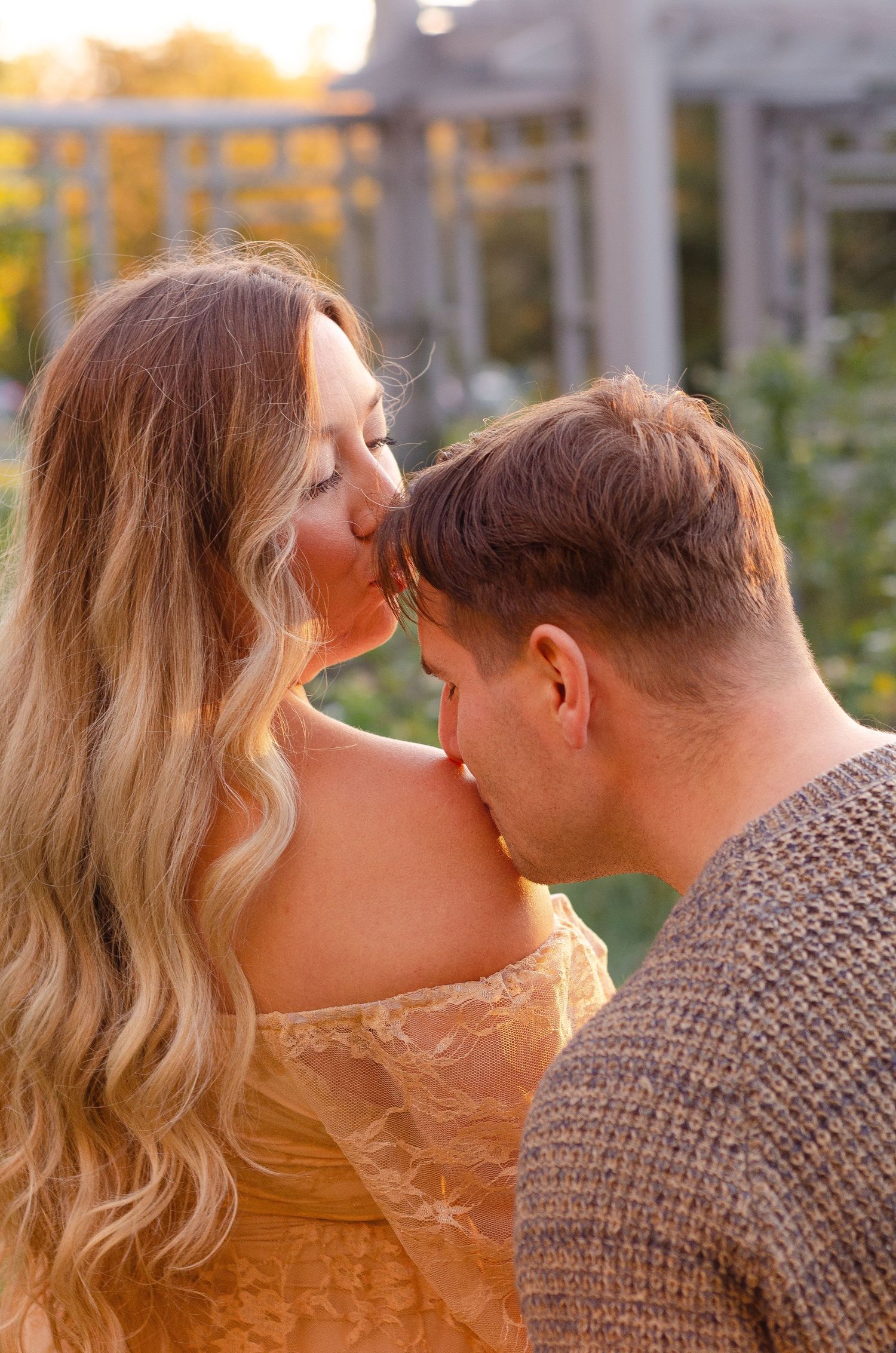 Intimate sunset moment captured in warm golden light. Maternity photos by KM Conceptions Photography in Columbus, OH.