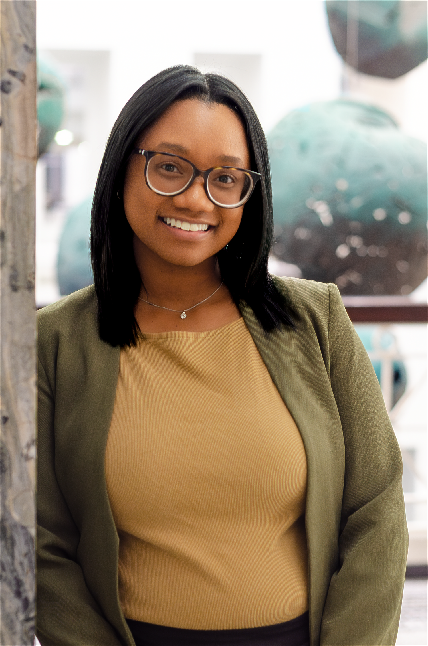 Indoor portrait session showcasing business professional attire. Photos by KM Conceptions Photography.