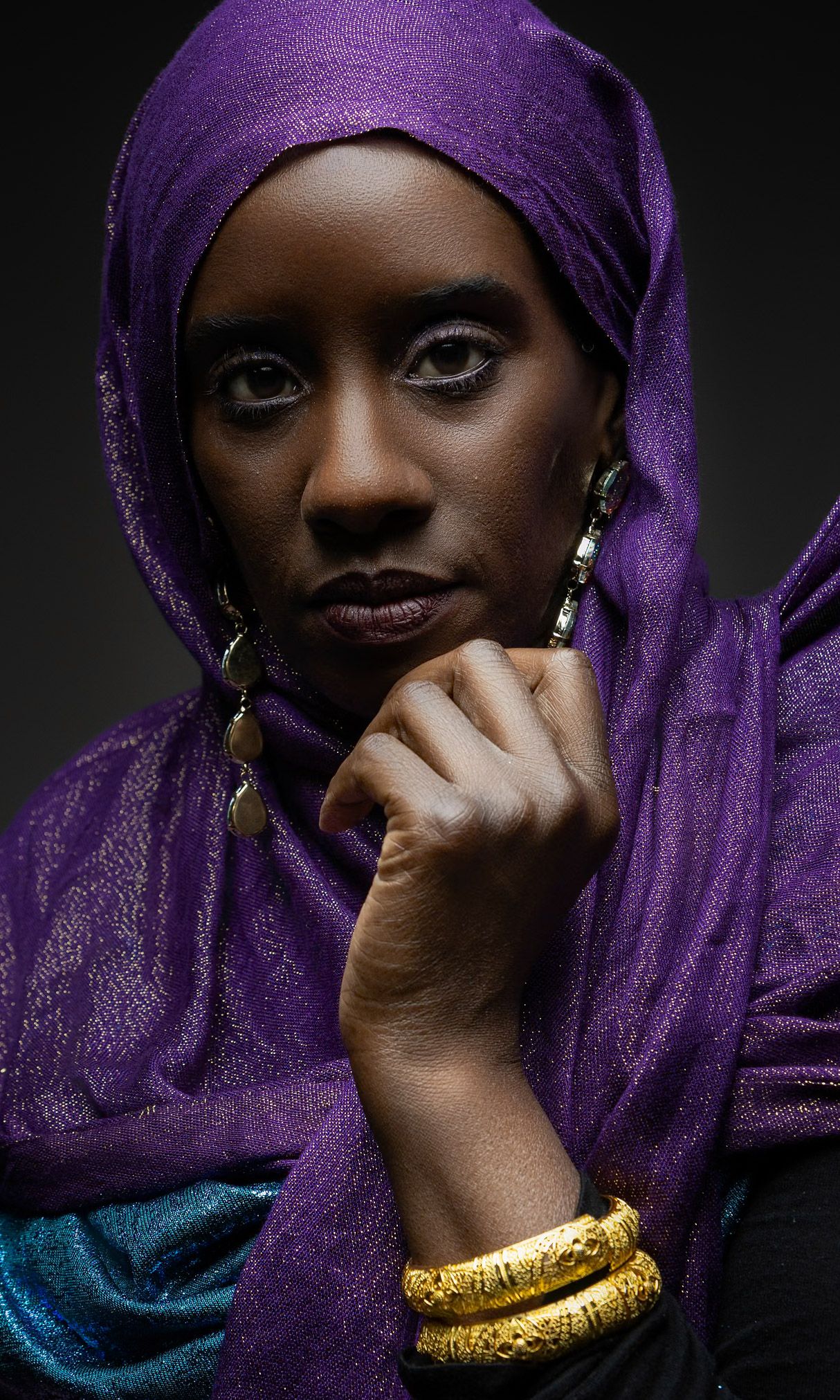 Powerful Black woman portrait with elegant lighting and bold colors. Premium studio photography session in Houston for branding and editoria