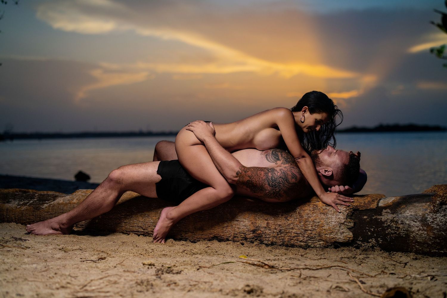 Couple embracing during a romantic couples boudoir photography session at sunset in Orlando by Shoots with Kay.