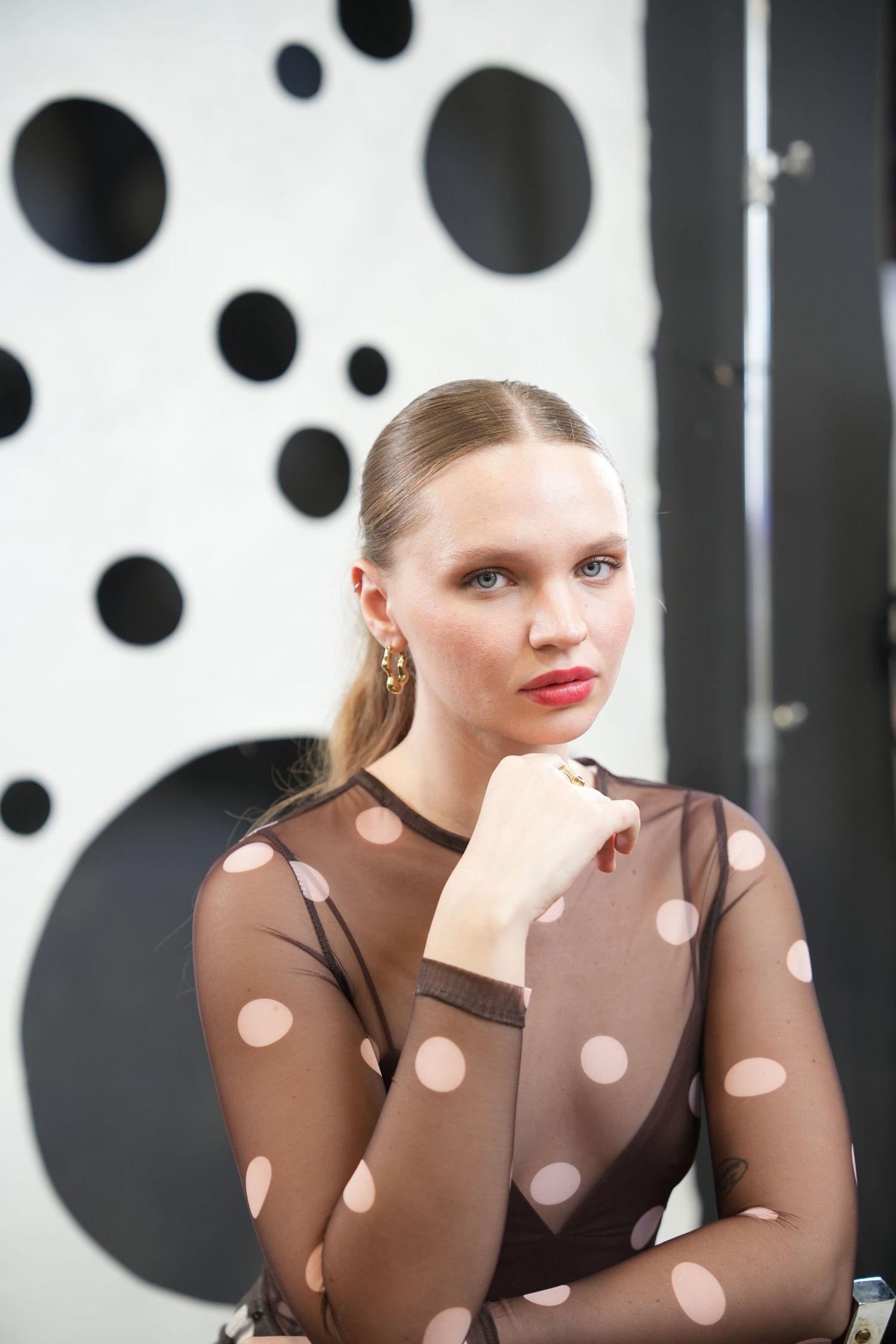 A very strong beauty and fashion portrait with a clean editorial style.