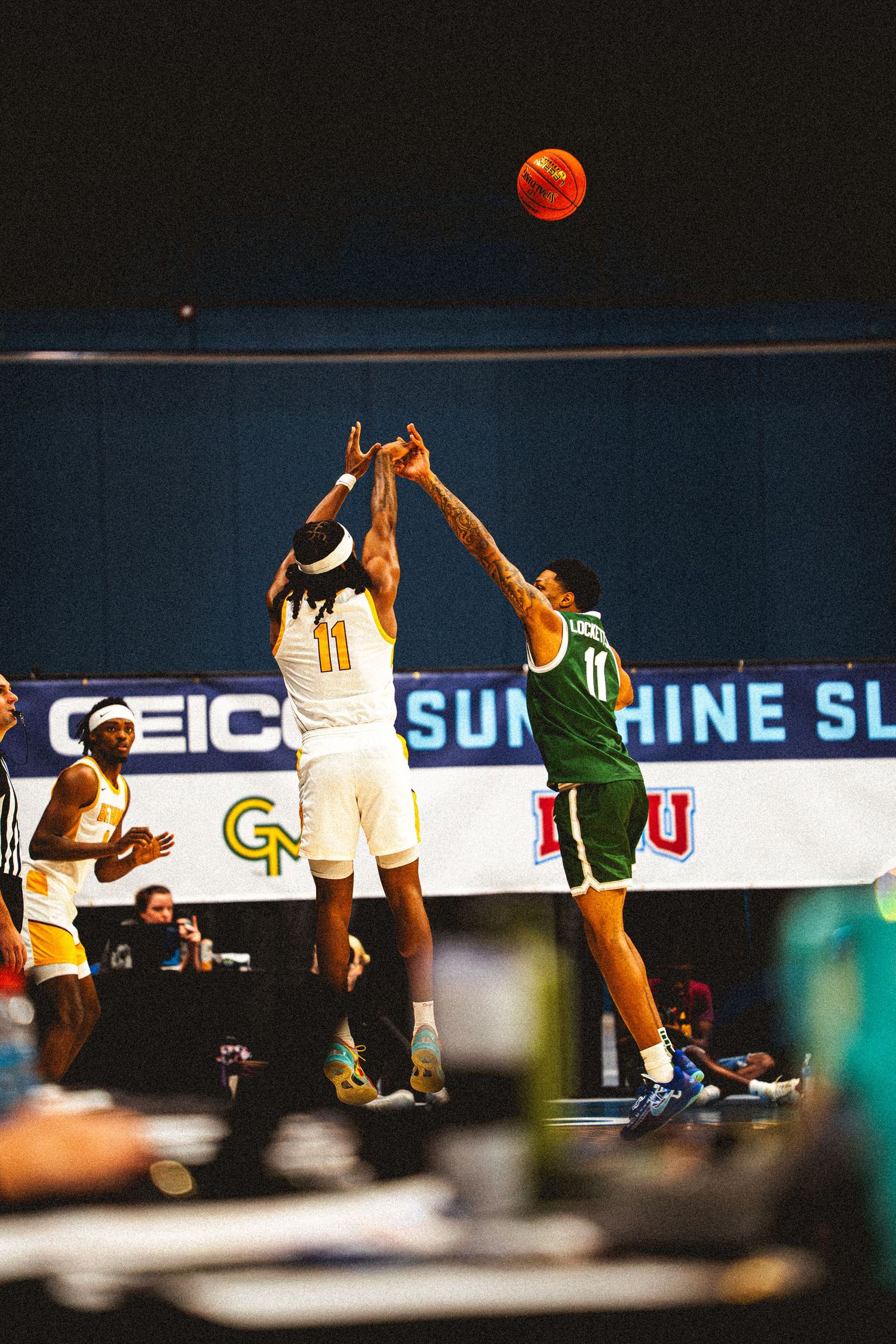 Bethune-Cookman player #11 shoots over a Jacksonville University defender at the Sunshine Slam.