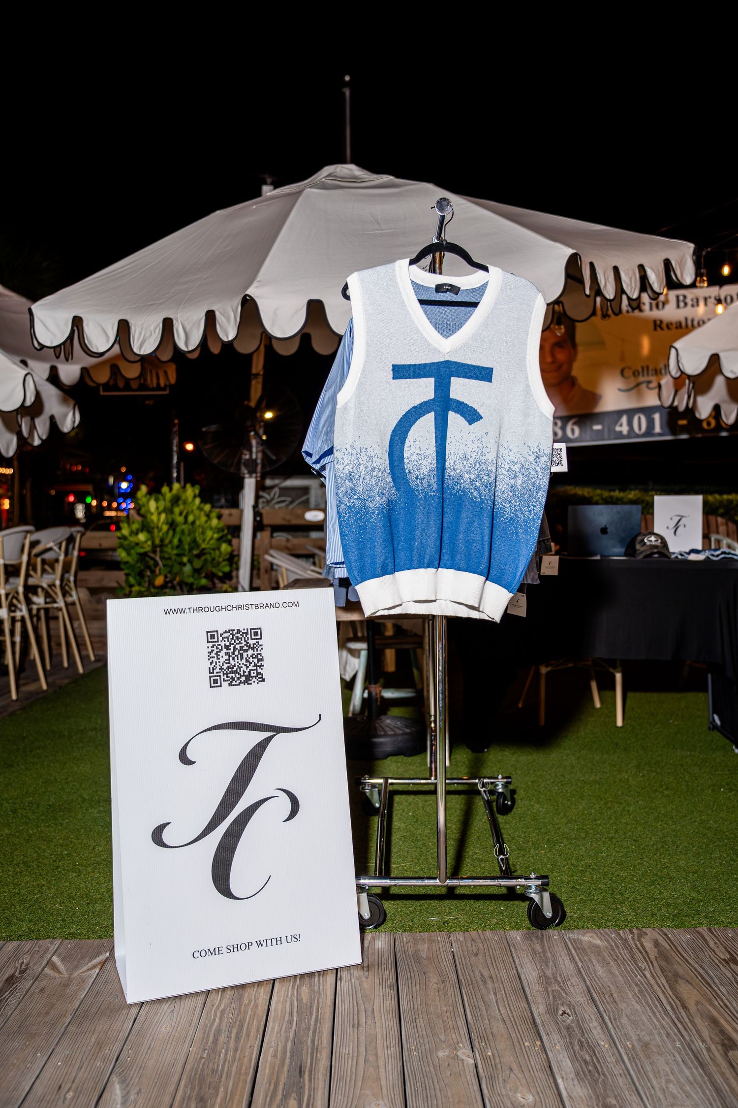 Blue and white TC logo basketball vest on display at Through Christ Brand pop-up shop.