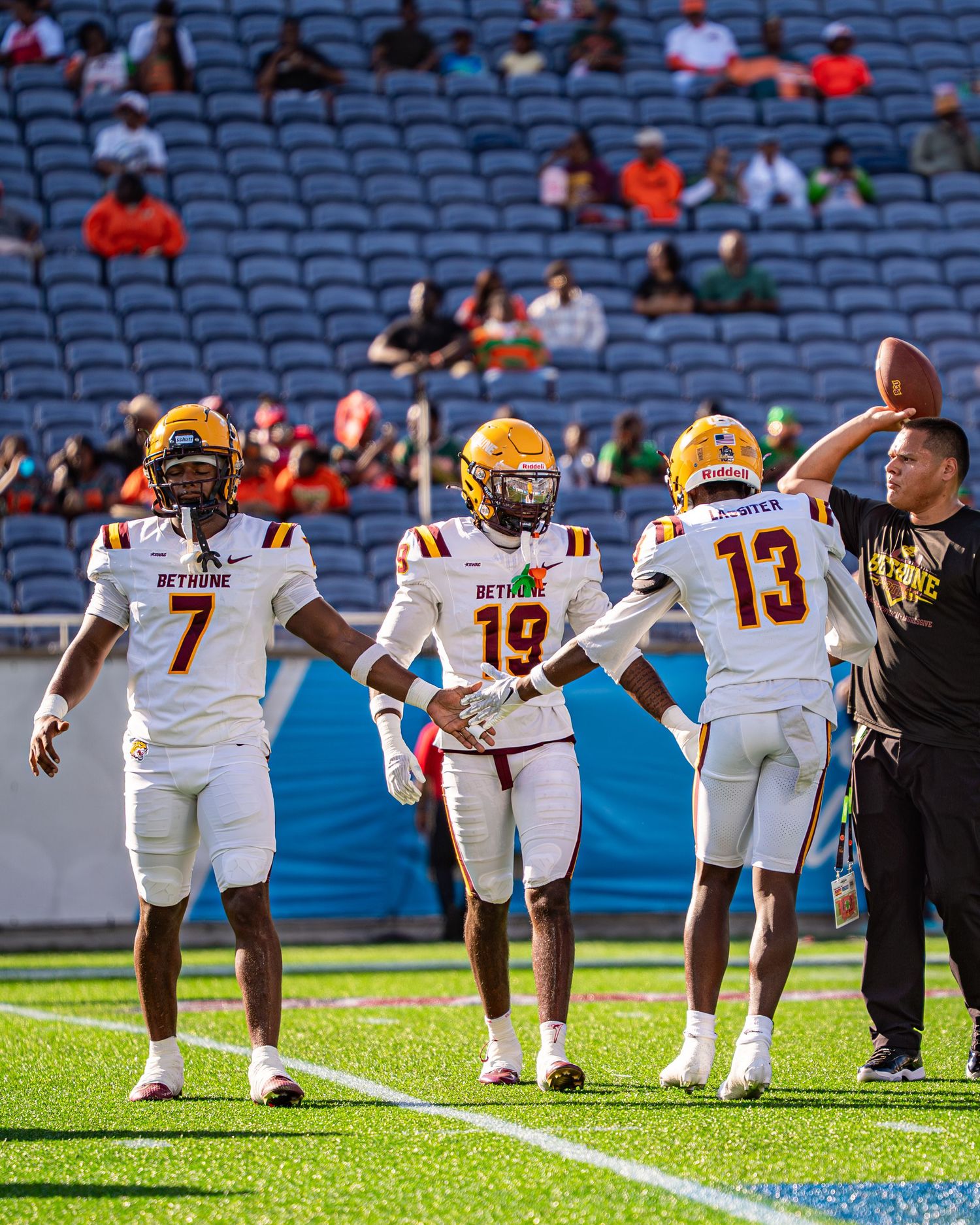 Bethune-Cookman wide receivers warm up on field before Florida Classic football game.