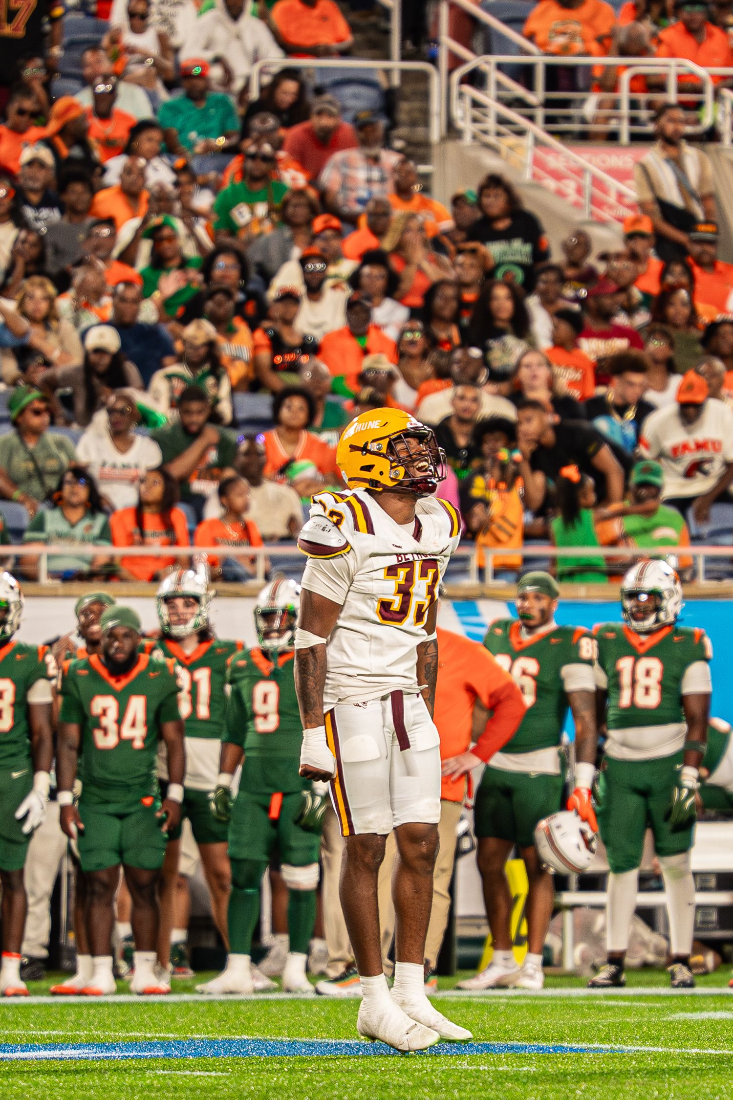 Bethune-Cookman football player #33 stands on the field during a game against FAMU.