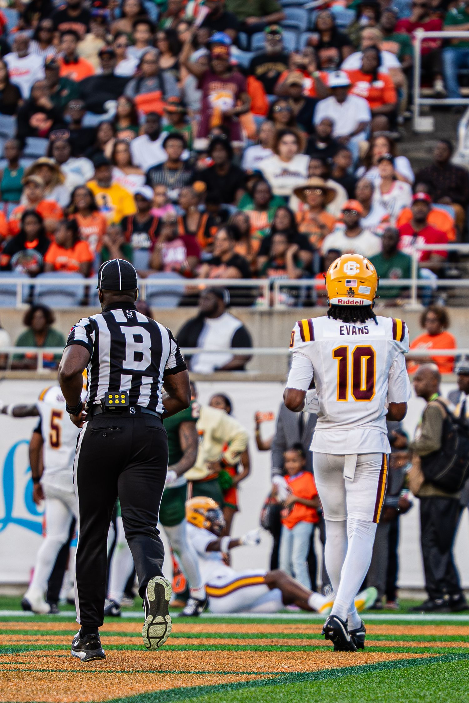 Bethune-Cookman player Evans number 10 walks sideline during Florida Classic football game.