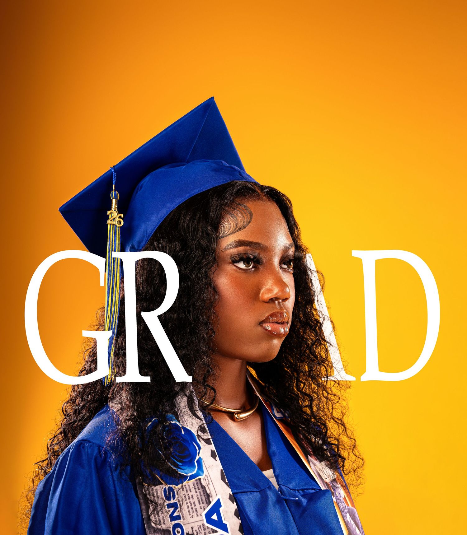 Confident Black female graduate in blue cap and gown posing with GRAD text overlay on golden yellow background.