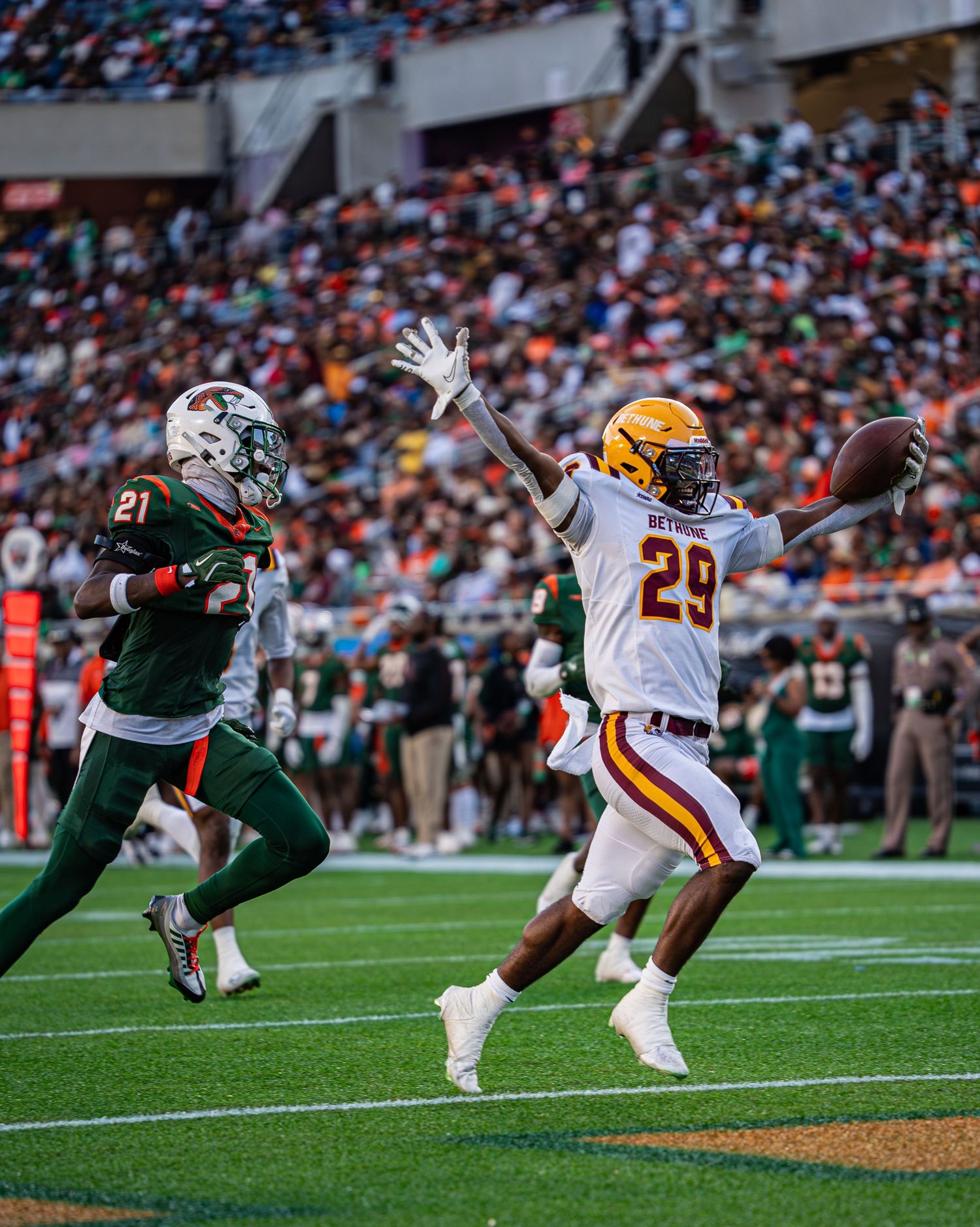 Bethune-Cookman player number 29 reaches for pass during Florida Classic football game.
