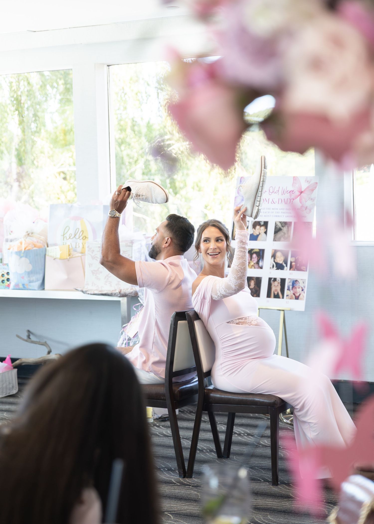 Mom-to-be and Dad-to-be playing games at their baby shower at Harbor Club at Prime in Huntington New York. Photo by Captured by Cristino