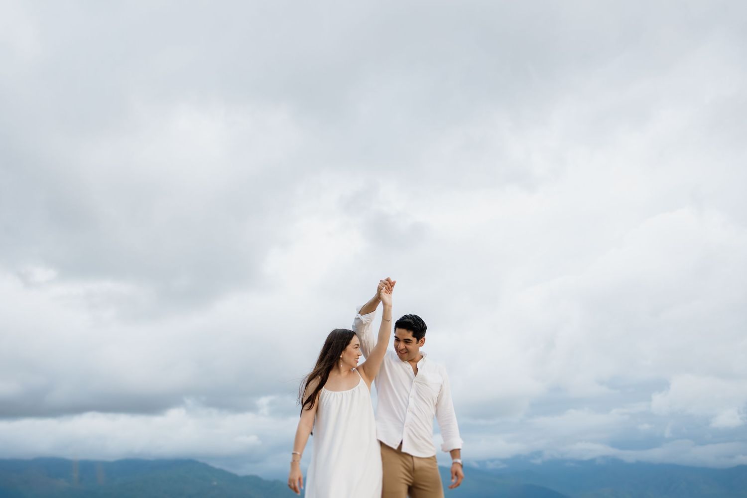 Couple walking hand in hand through the cobblestone streets of Puerto Vallarta