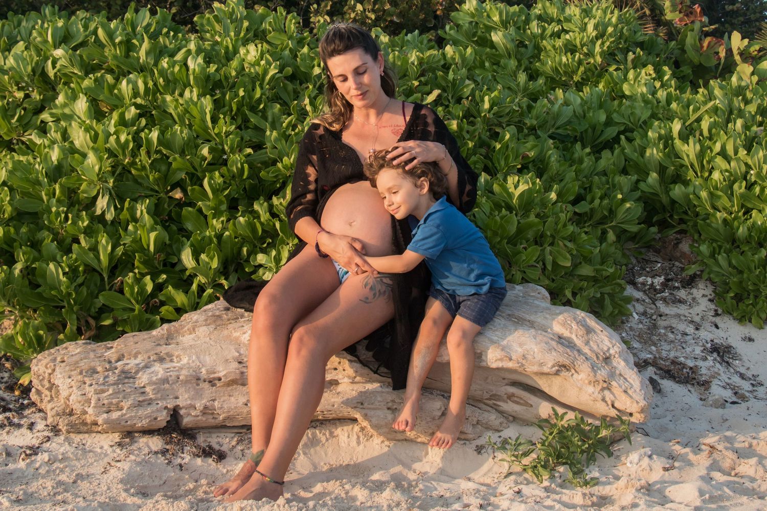 Maternity session at Sayulita beach during sunset golden light