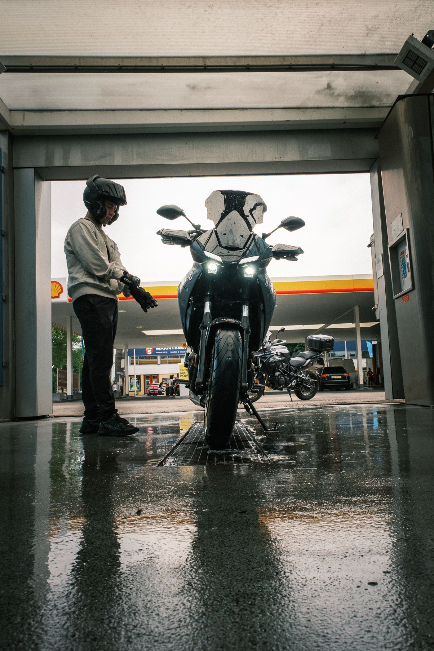 CFMOTO motorcycle photographed in Amsterdam with cinematic urban lighting and detailed composition.