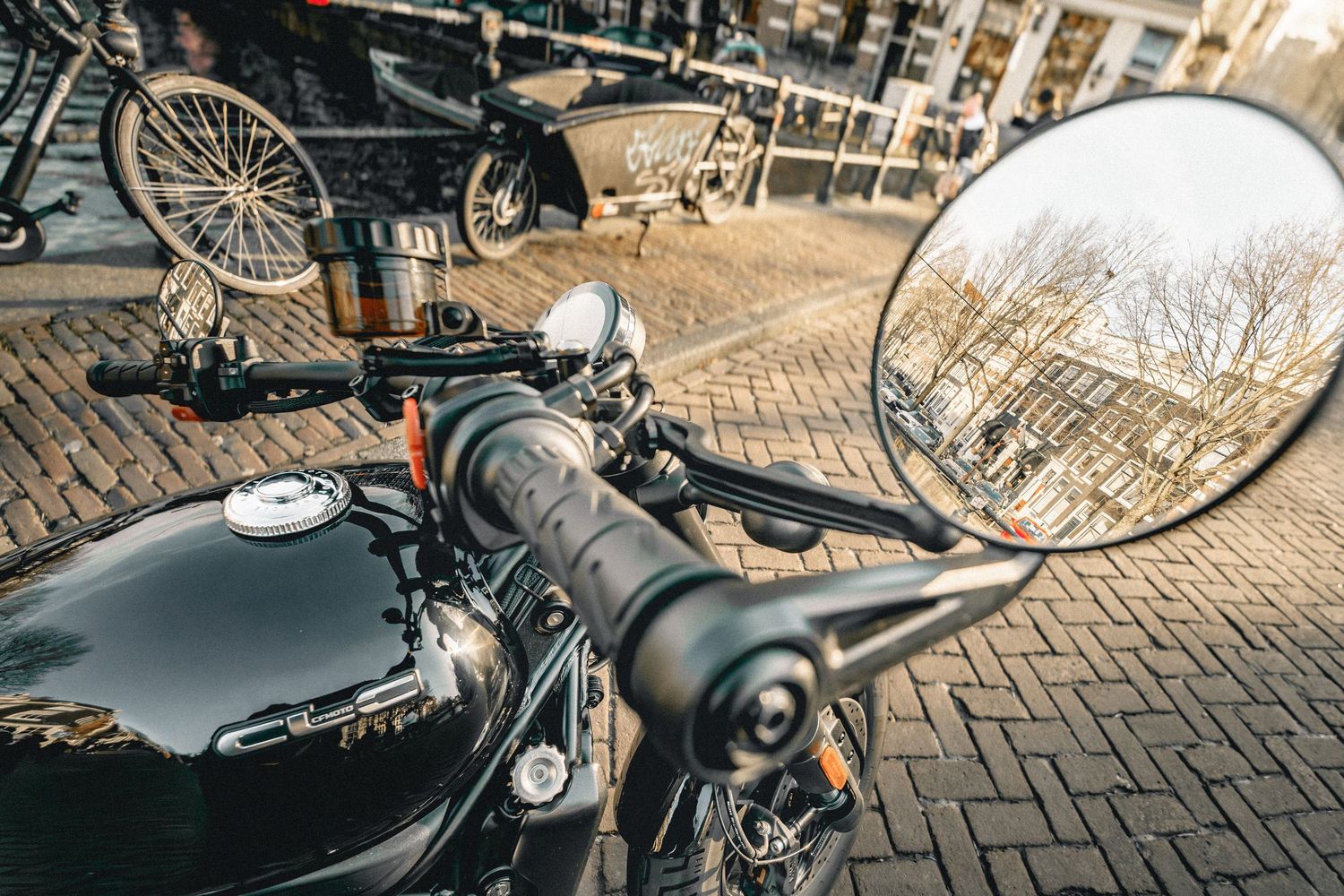 CFMOTO motorcycle photographed in Amsterdam with cinematic urban lighting and detailed composition.