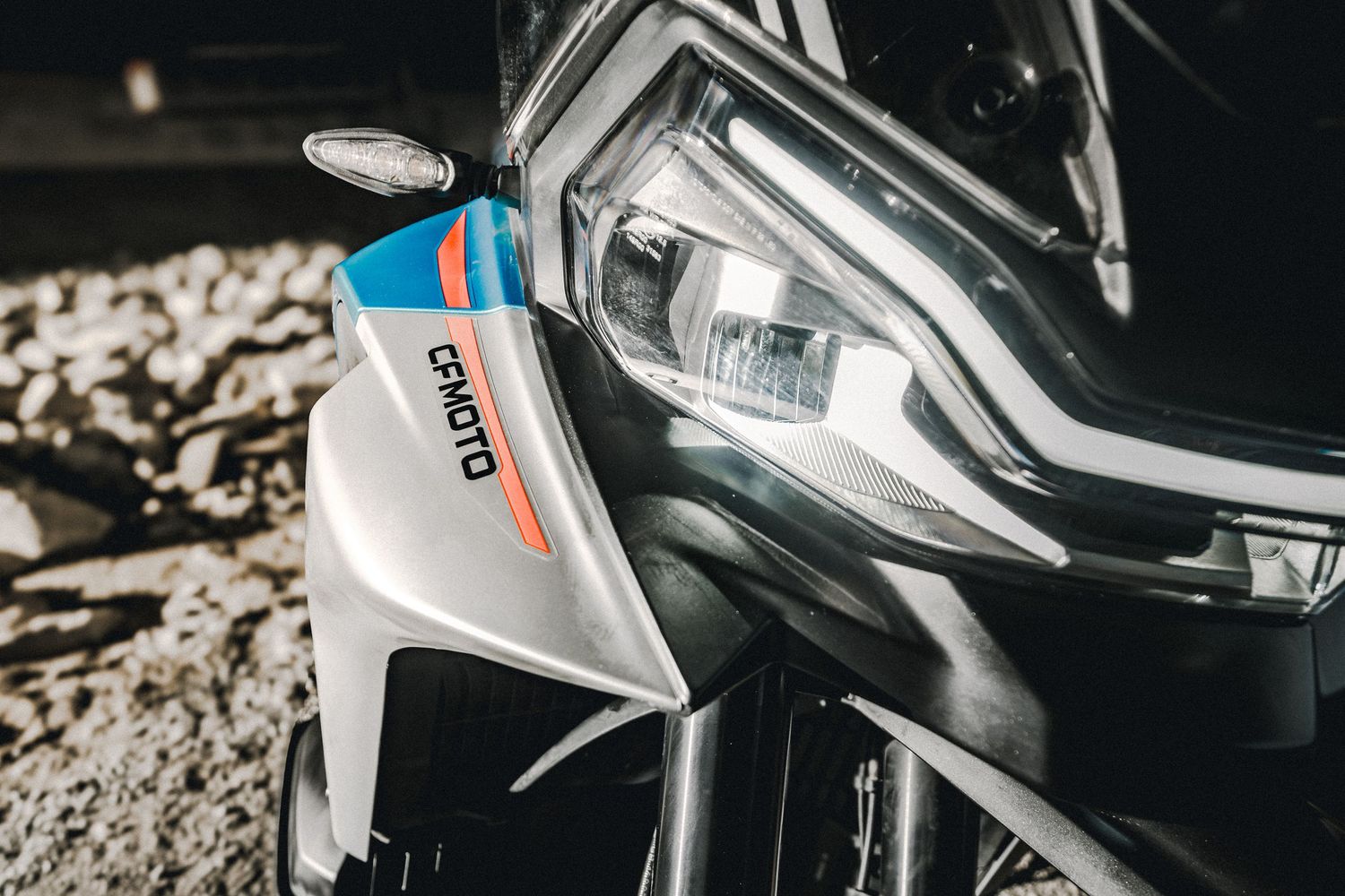CFMOTO motorcycle photographed in Amsterdam with cinematic urban lighting and detailed composition.