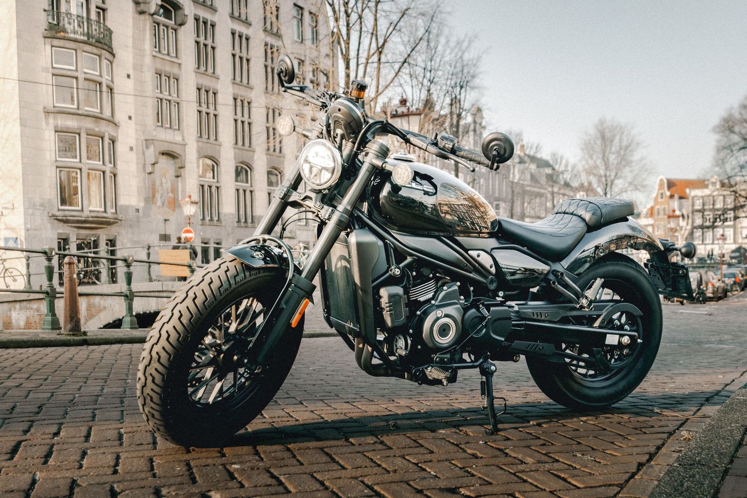 CFMOTO motorcycle photographed in Amsterdam with cinematic urban lighting and detailed composition.
