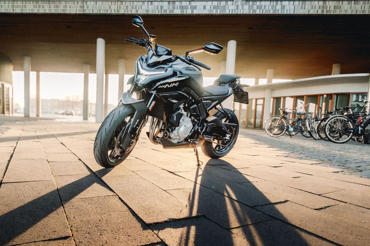 CFMOTO motorcycle photographed in Amsterdam with cinematic urban lighting and detailed composition.