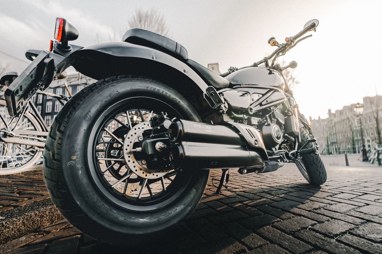 CFMOTO motorcycle photographed in Amsterdam with cinematic urban lighting and detailed composition.