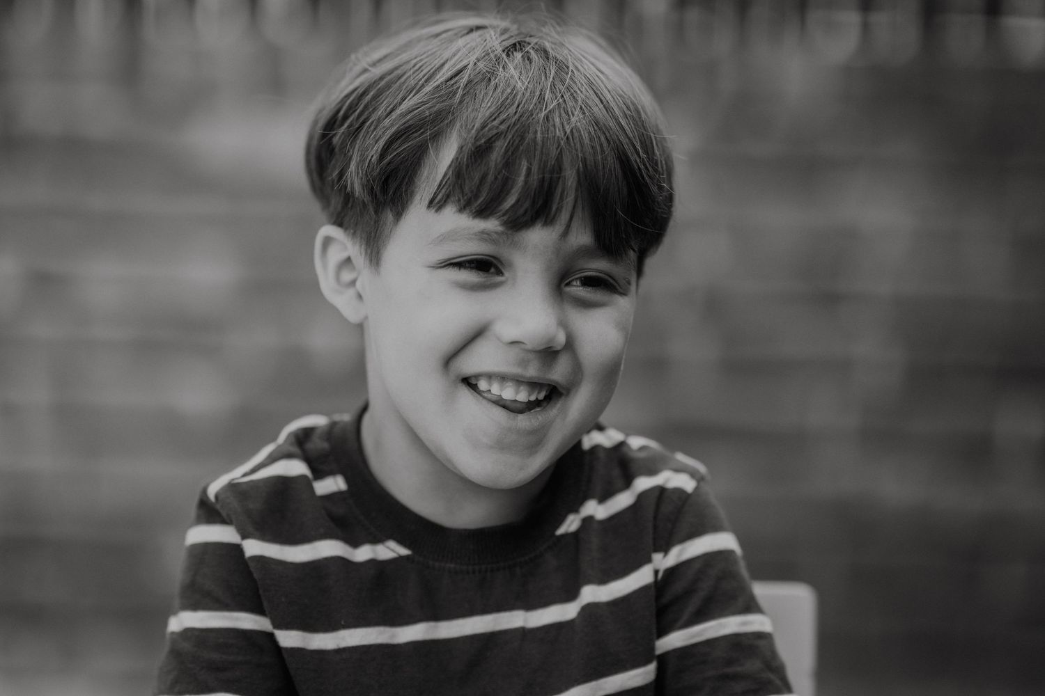 Black and white candid shots showing cheerful smiles and natural expressions.