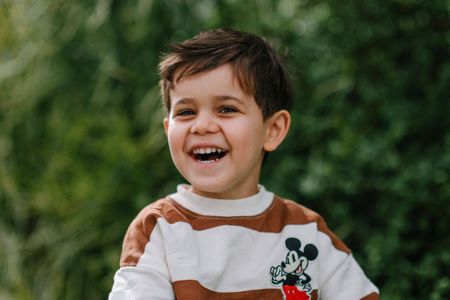 Progressive shots of laughter and joy outdoors with natural lighting.