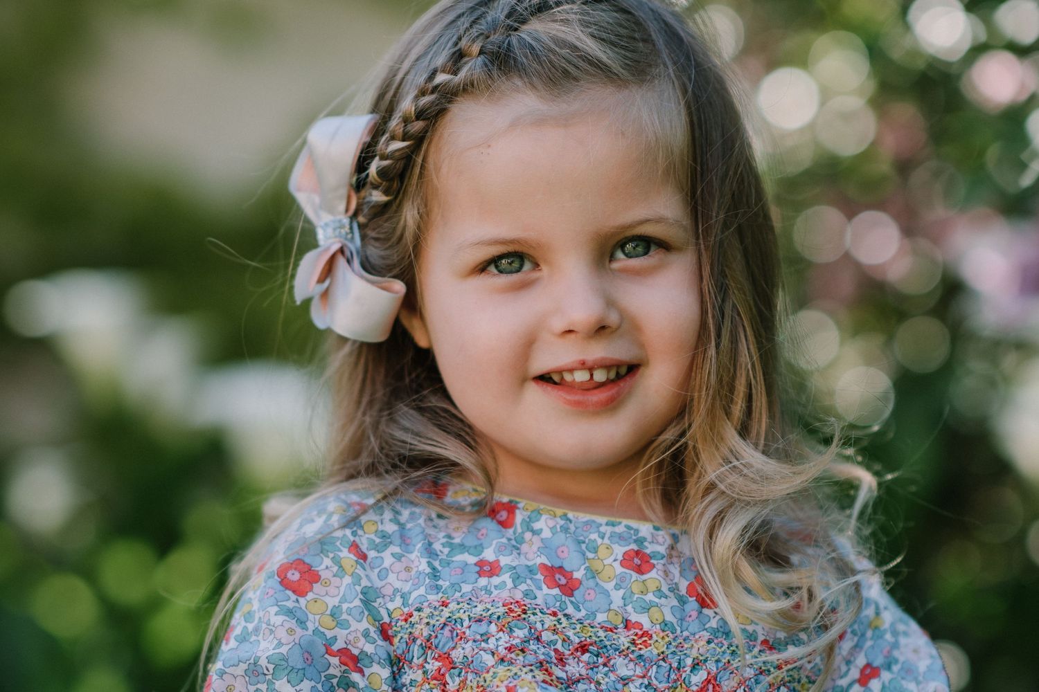 Playful expressions captured in series while wearing floral dress outdoors.