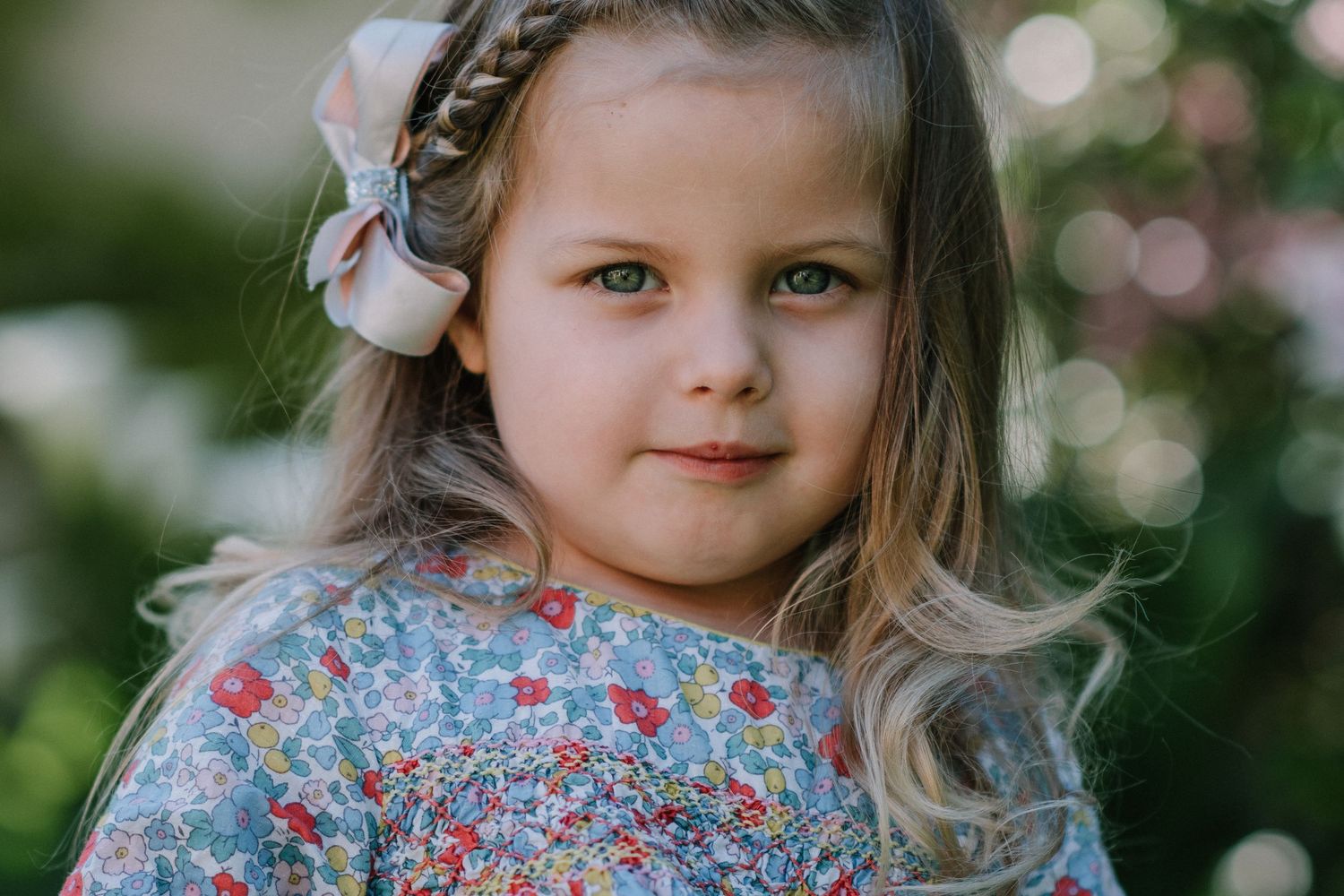 Series of candid moments in a floral dress with natural garden backdrop.