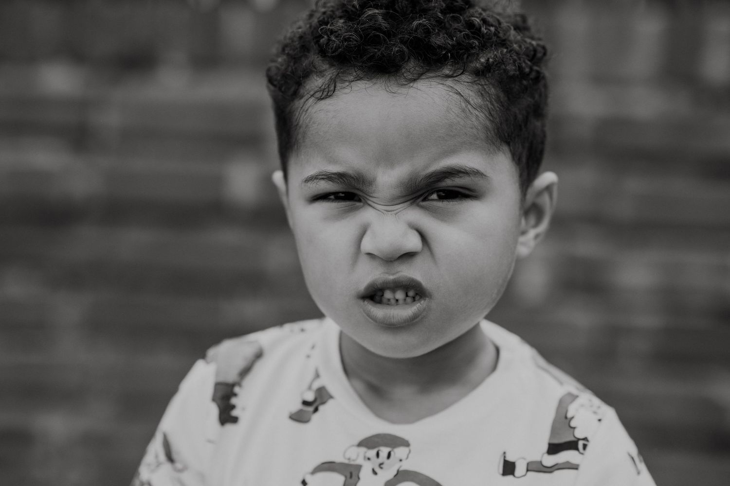 A sequence of expressive black and white portraits showcasing various emotions.