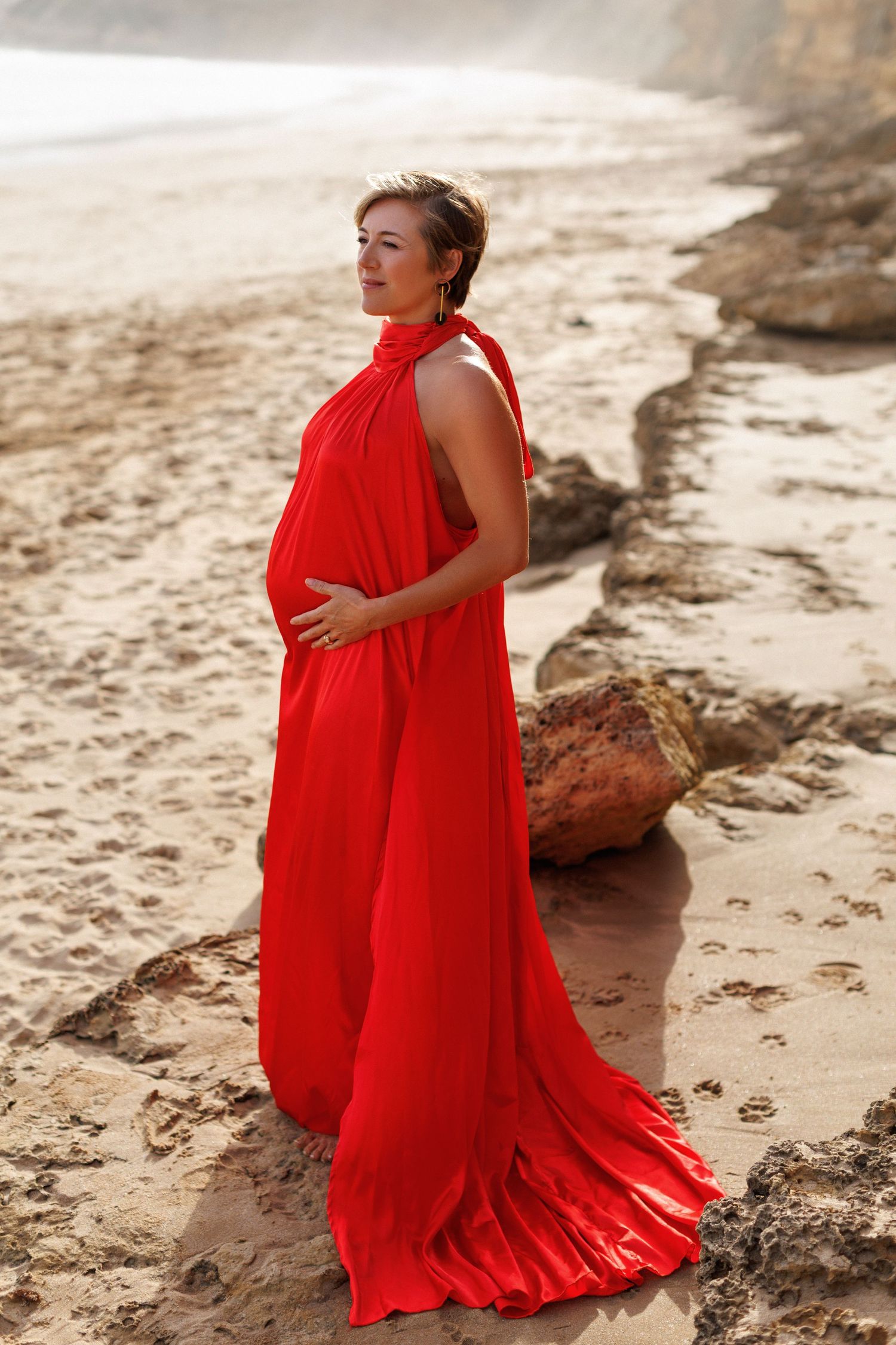 Beach maternity photography session capturing family connection